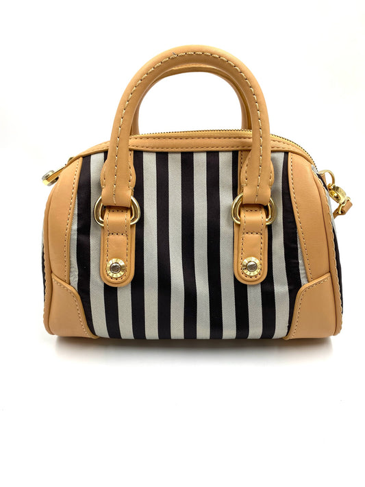 Henri Bendel mini stripe nylon bag with black and white stripes, tan leather trim, top handles, and gold hardware.