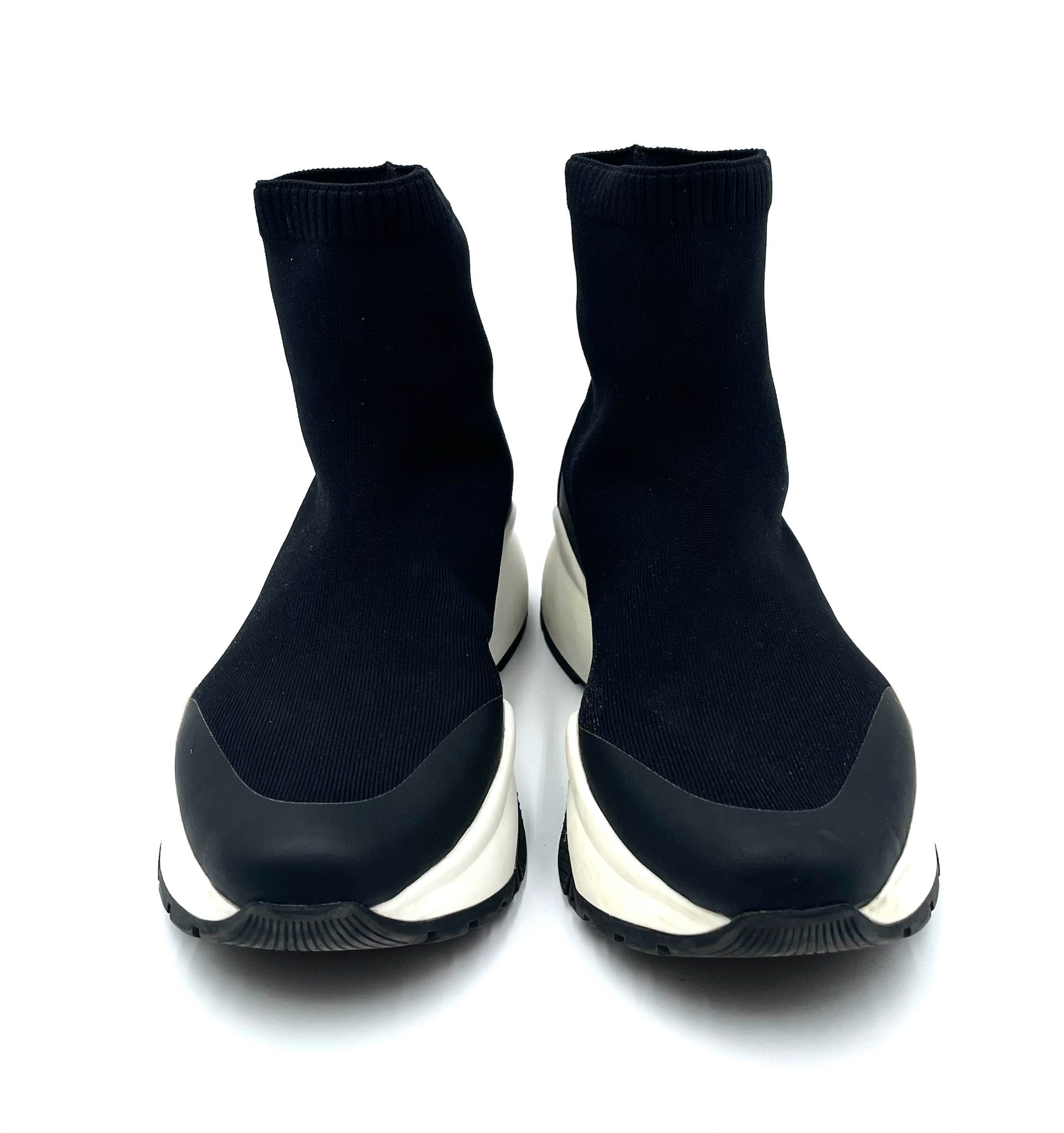 Jimmy Choo Landon black stretch-knit sock sneakers with white rubber platform soles and slip-on design.