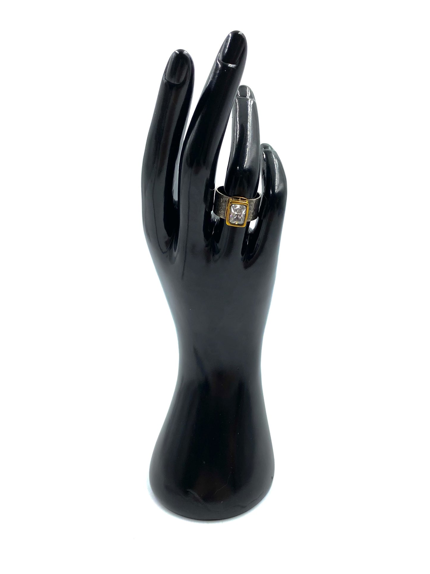 Karyn Chopik Empress sterling silver ring, size 7.5, with a rectangular cubic zirconia crystal on a black hand display.