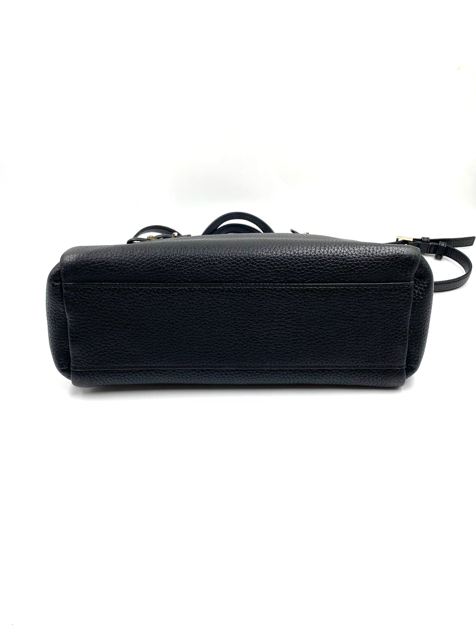 Kate Spade black pebbled leather tote bag, bottom view, with top handles and a detachable strap.