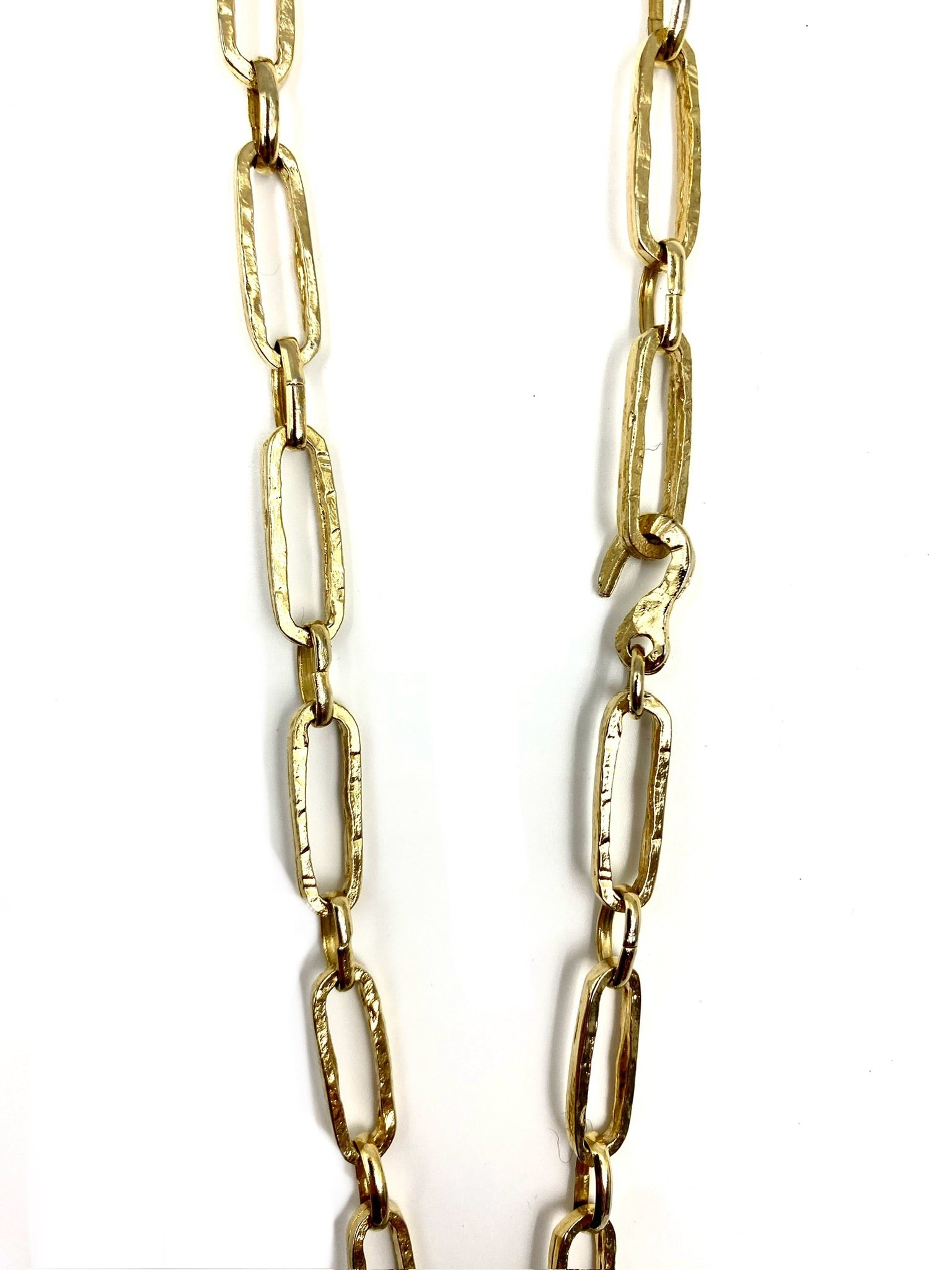 Las Surenas gold plated long chain necklace with textured oval links and a tiger head clasp.