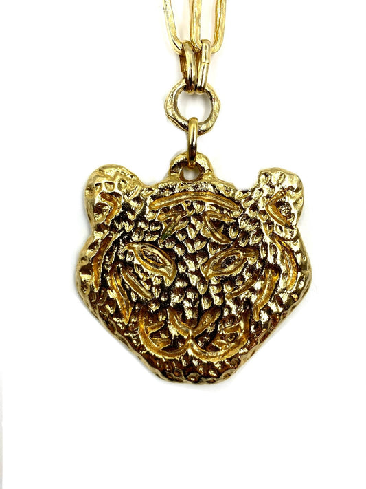 Las Surenas gold plated tiger head pendant on a long chain necklace.