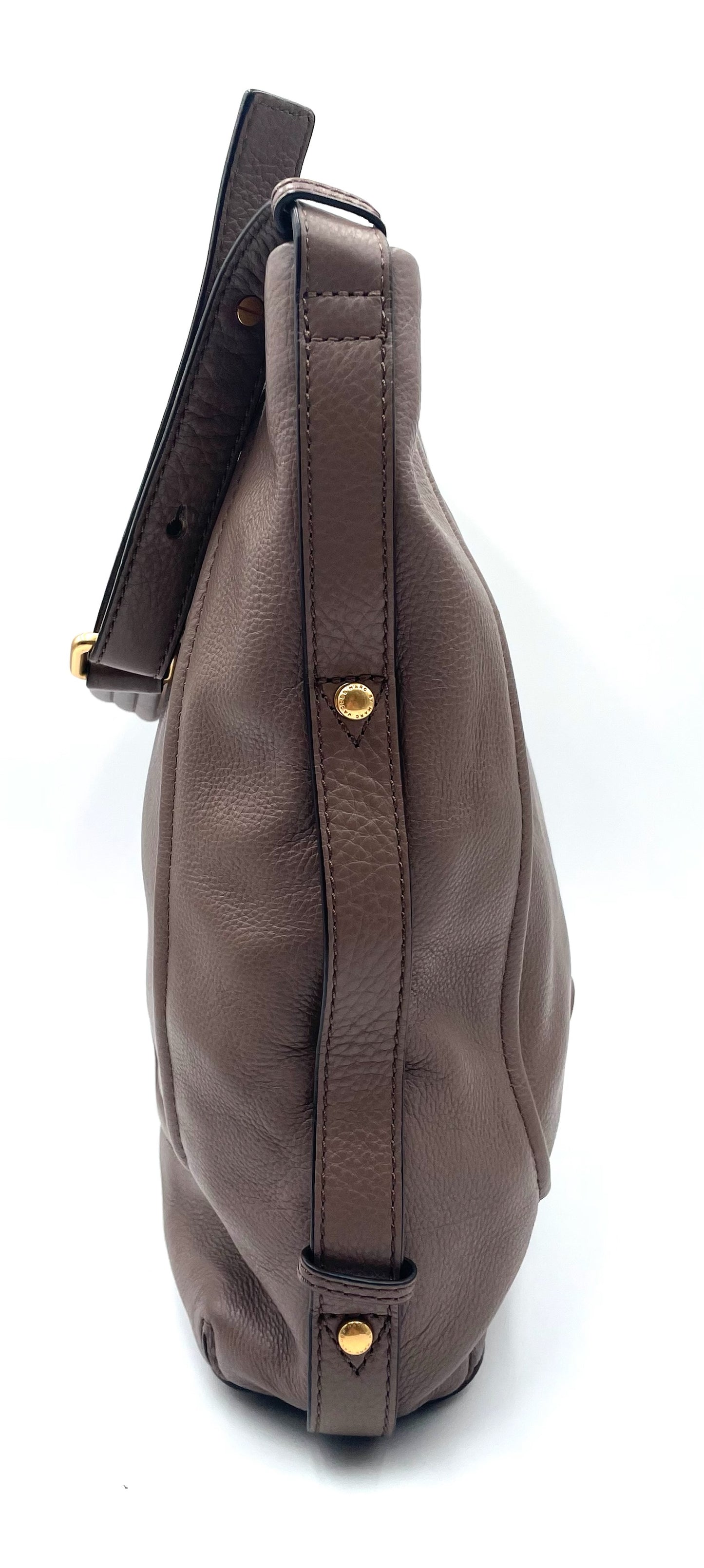 Marc Jacobs Revolution taupe leather hobo bag with gold-tone hardware and slouchy silhouette.