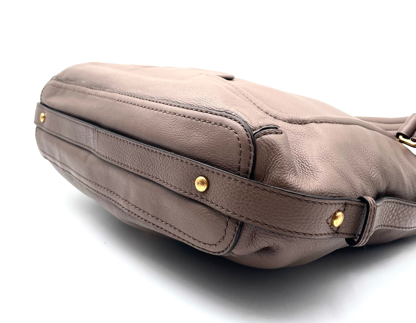Marc By Marc Jacobs Revolution taupe leather hobo bag with gold-tone hardware and slouchy silhouette.