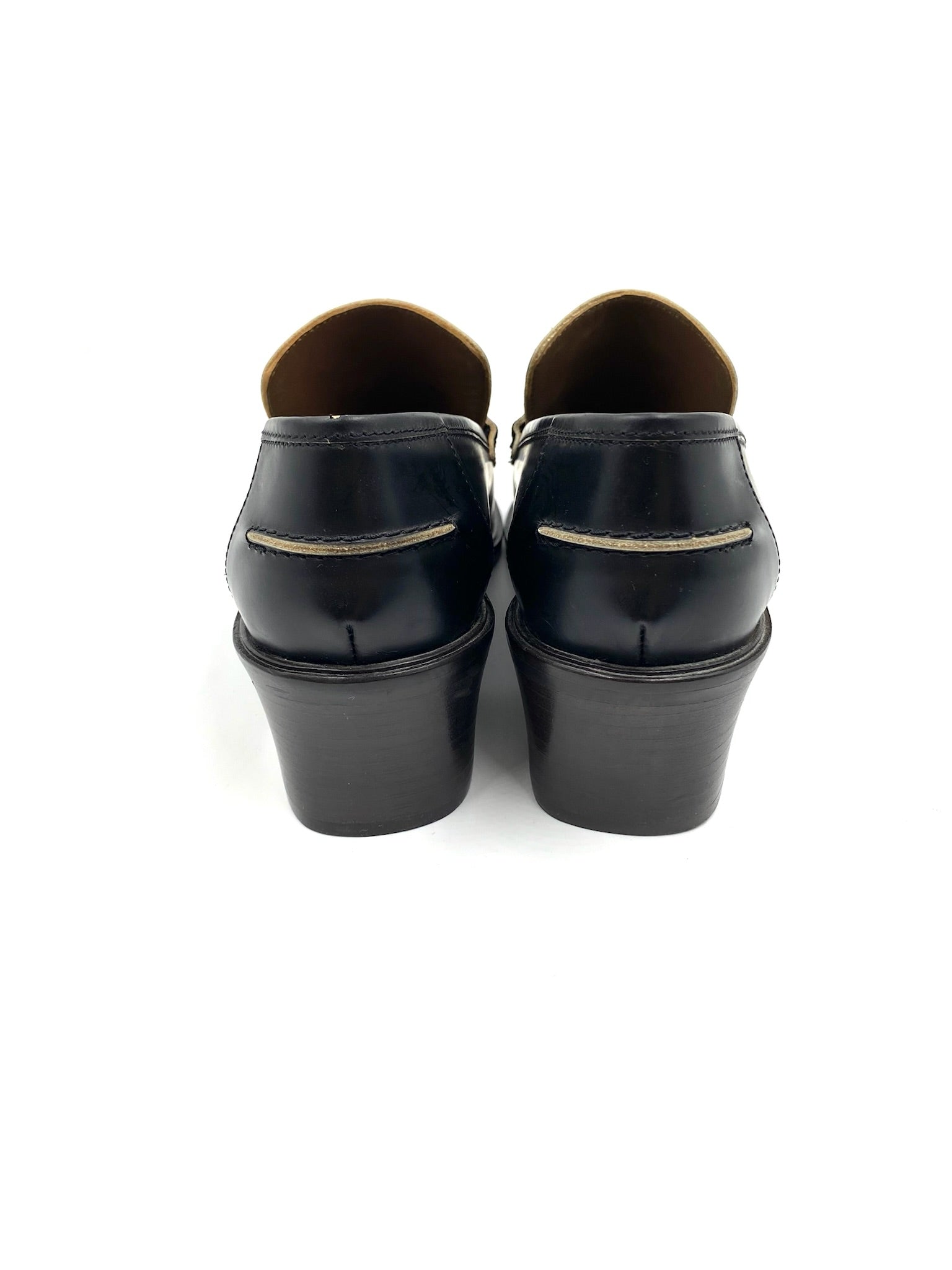 Marni black leather loafers, size 37.5, with block heels and exposed edging detail, viewed from the back.