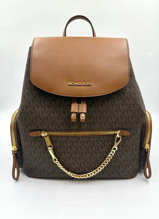 Michael Kors Large Logo Jet Set Backpack in brown monogram canvas with a tan leather flap and gold hardware.