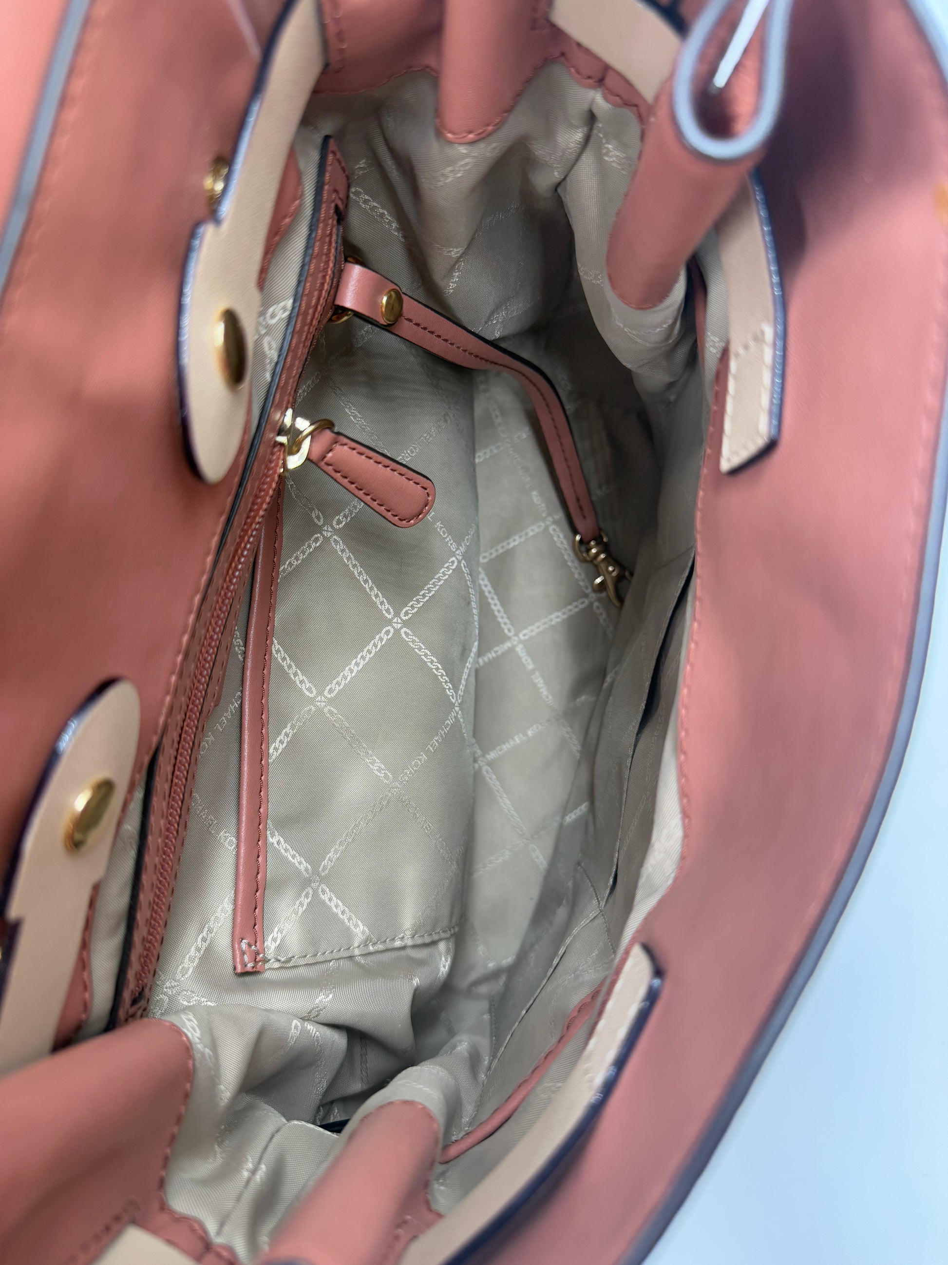 Open Michael Kors Peach Bedford large leather convertible backpack interior with logo lining.