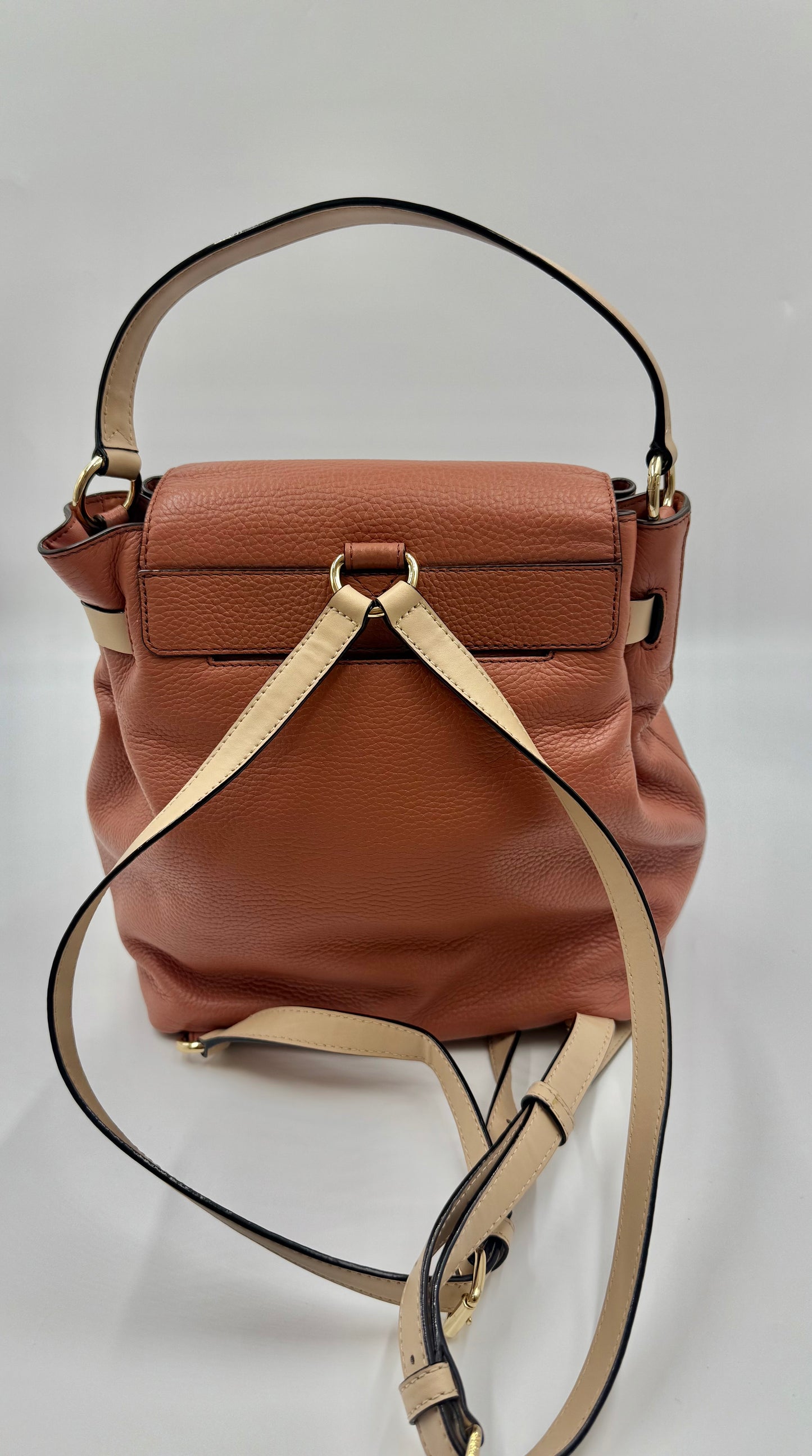 Michael Kors Peach Bedford large leather convertible backpack with gold-tone hardware and adjustable straps.
