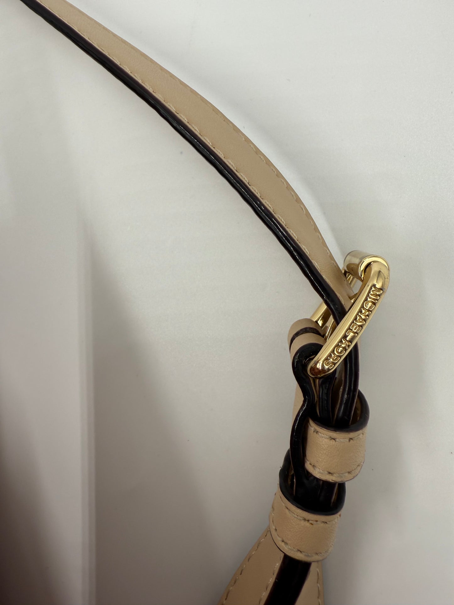 Michael Kors Peach Bedford large leather convertible backpack strap with gold-tone hardware and logo.