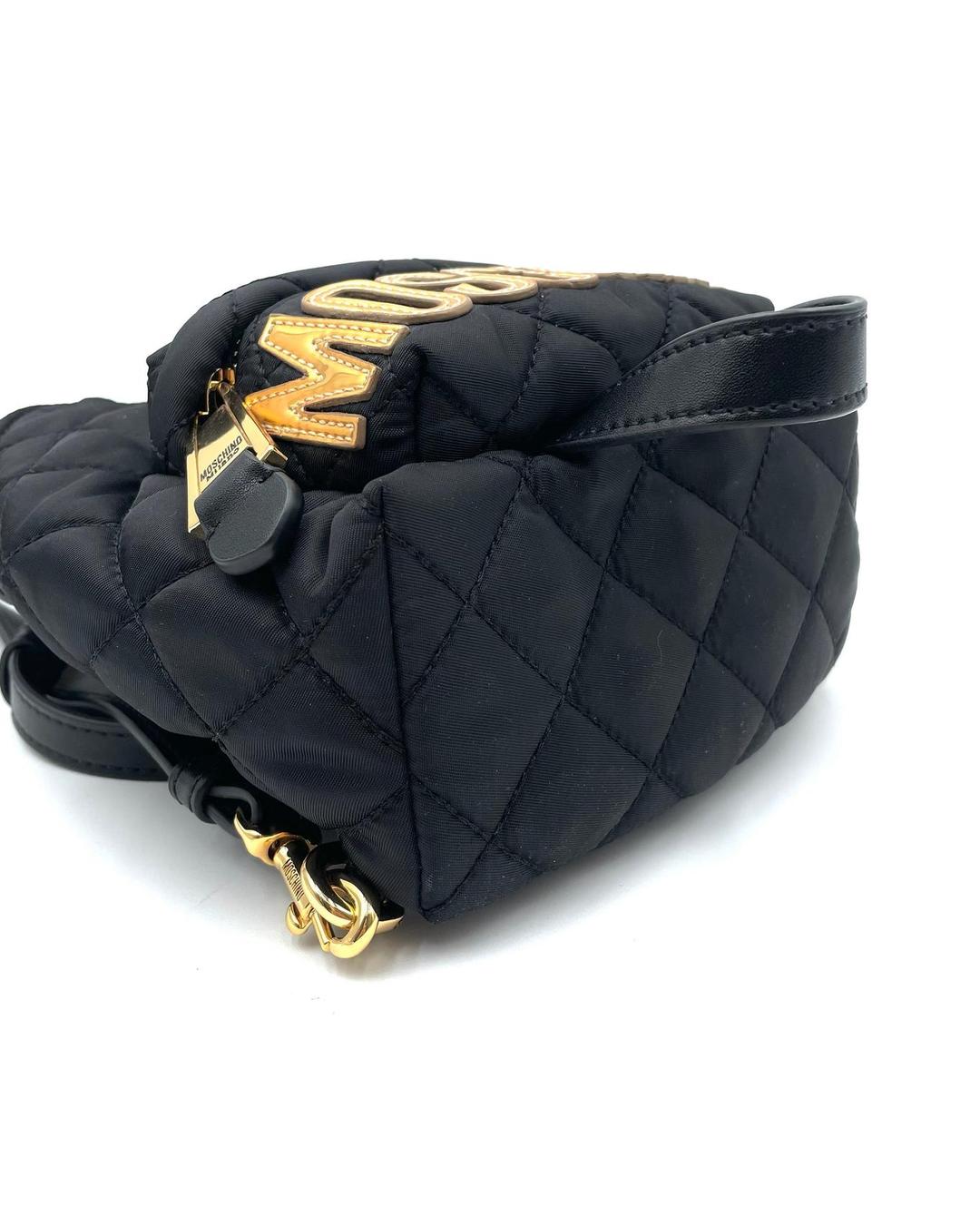 Black quilted nylon mini backpack by Moschino with gold-tone logo hardware and zip closure.