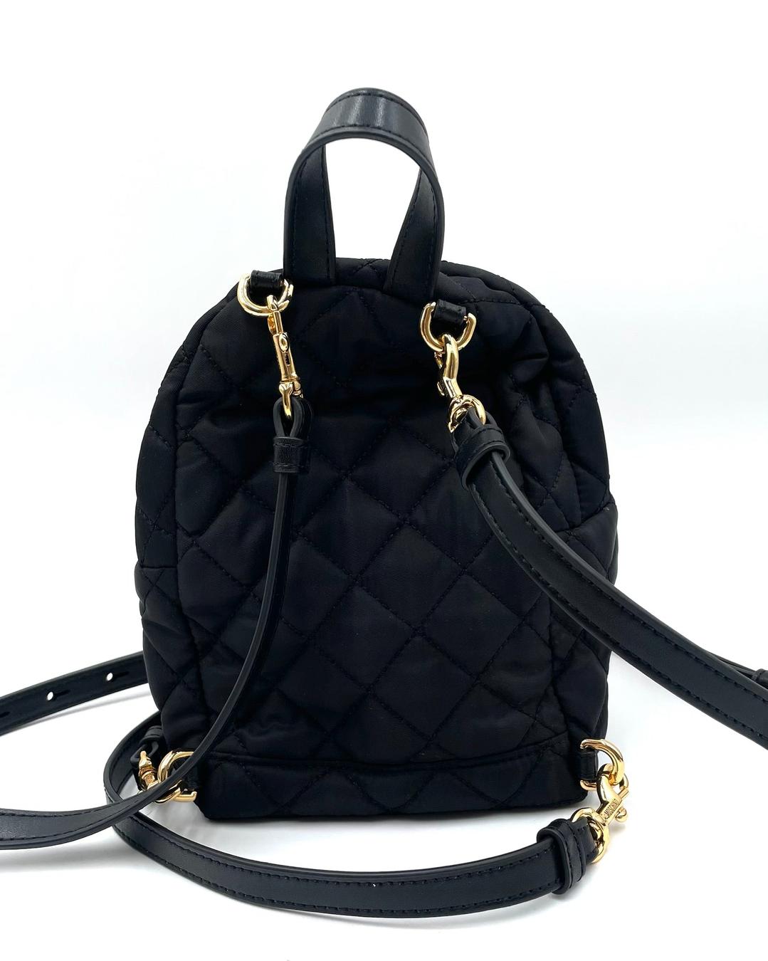 Moschino black quilted nylon mini backpack with gold-tone hardware and detachable shoulder straps.
