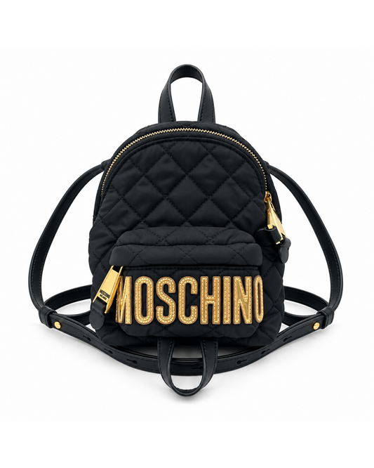 Black mini quilted nylon Moschino backpack with gold logo lettering and hardware.