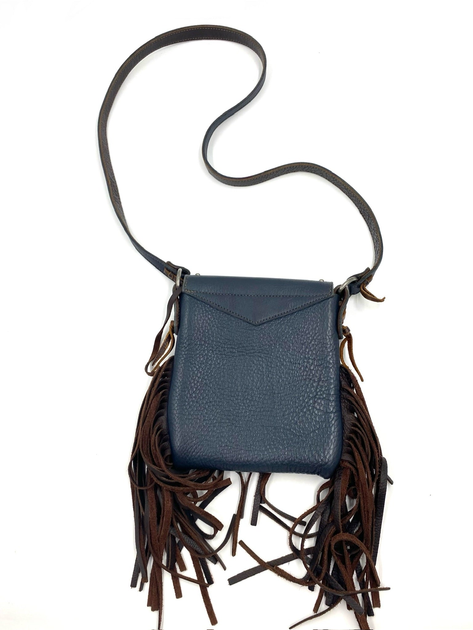 Navy fringe leather crossbody bag with brown tassels, silver studs, and magnetic closure.