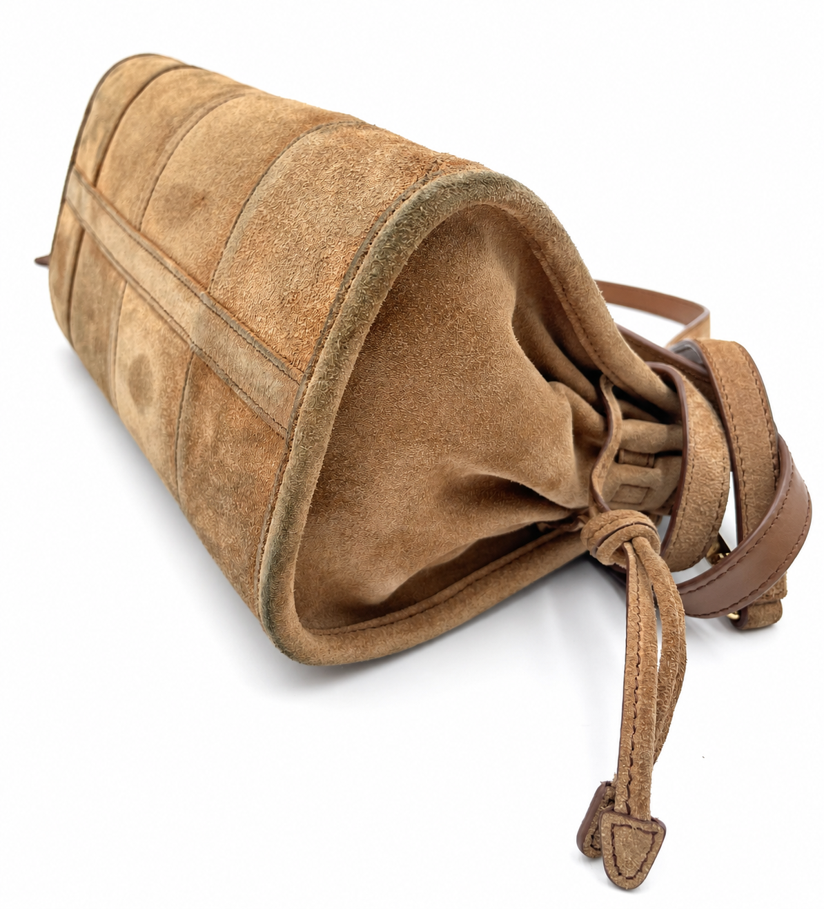 Prada Bonnie small cinnamon brown suede shoulder bag with structured paneling and a drawstring closure.