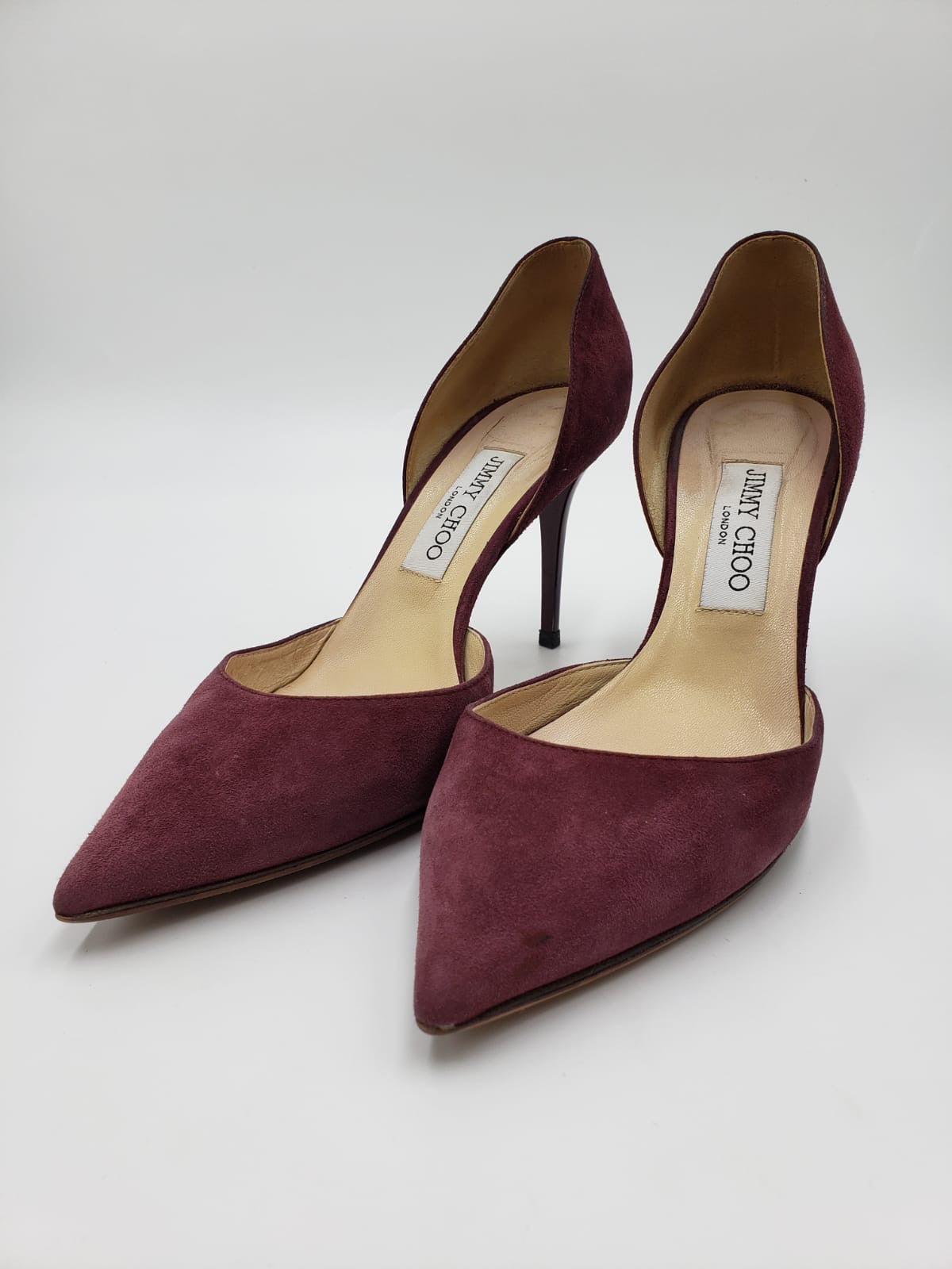 Jimmy Choo maroon suede pointed toe d'Orsay pumps with stiletto heels.