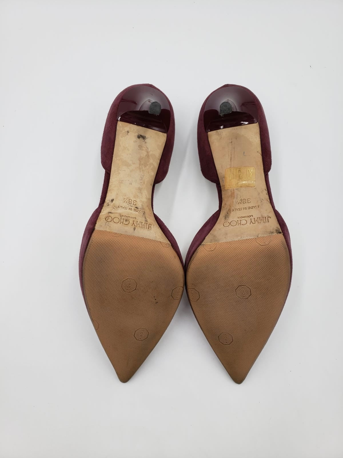 Jimmy Choo maroon suede pointed toe pumps, size 38.5, showing resoled bottoms and patent heels.