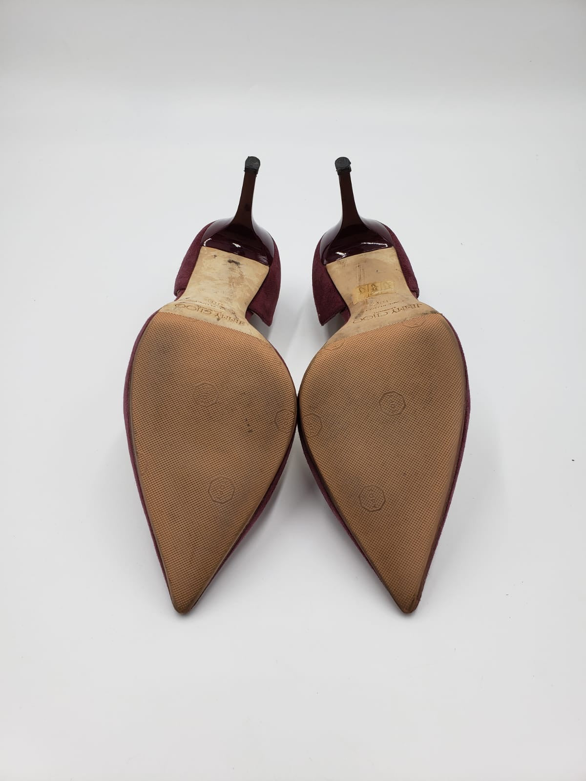 Prada maroon suede pointed toe pumps, size 38.5, showing resoled bottoms and heels.