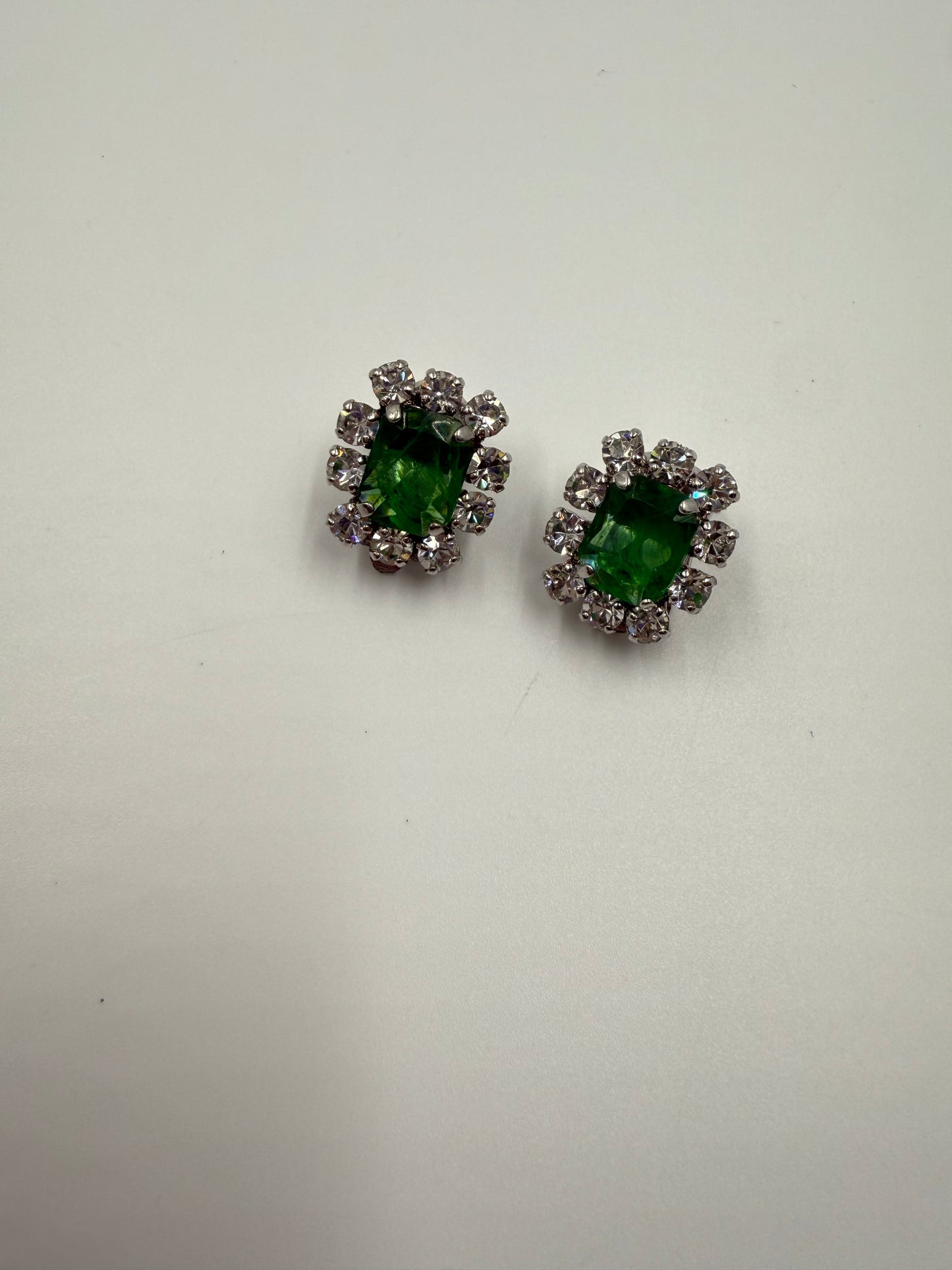 Rare 1973 Christian Dior emerald glass cabochon clip earrings with clear crystal rhinestones.