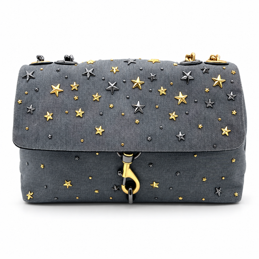 Rebecca Minkoff medium Edie flap bag in grey denim with gold and silver star studs and chain strap.
