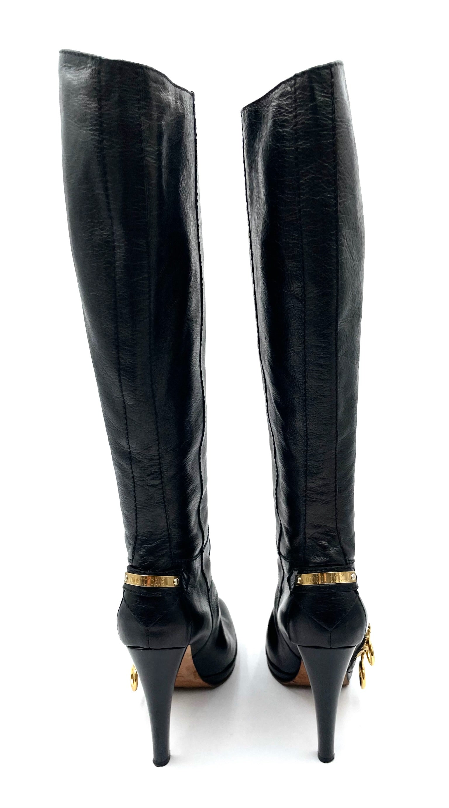 Roberto Cavalli black leather knee-high boots, size 39.5, featuring slim high heels and gold-tone hardware accents.