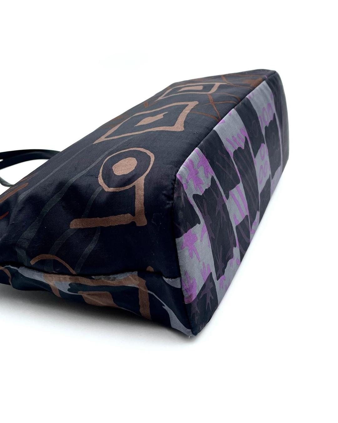 Salvatore Ferragamo nylon tote featuring a black and purple abstract geometric print with a structured base.