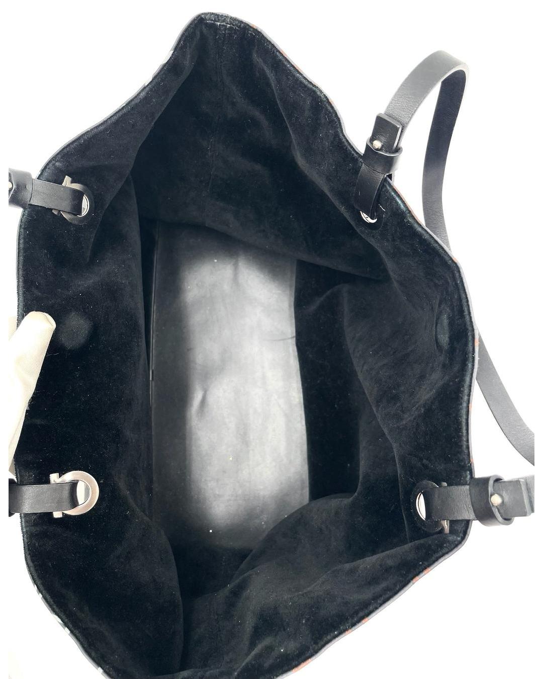 Interior view of a Salvatore Ferragamo nylon tote featuring a black suede lining and silver-tone hardware details.