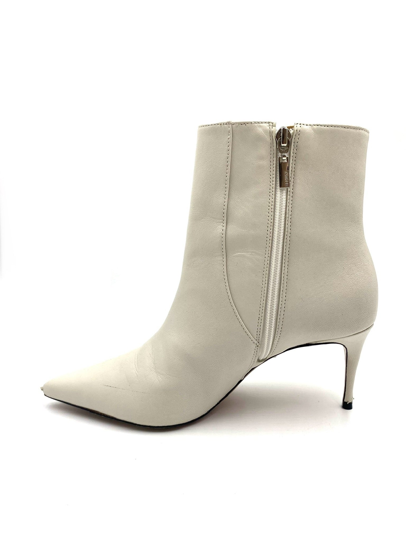 Schutz white leather pointed ankle boot, size 8B, with side zip closure and kitten heel.