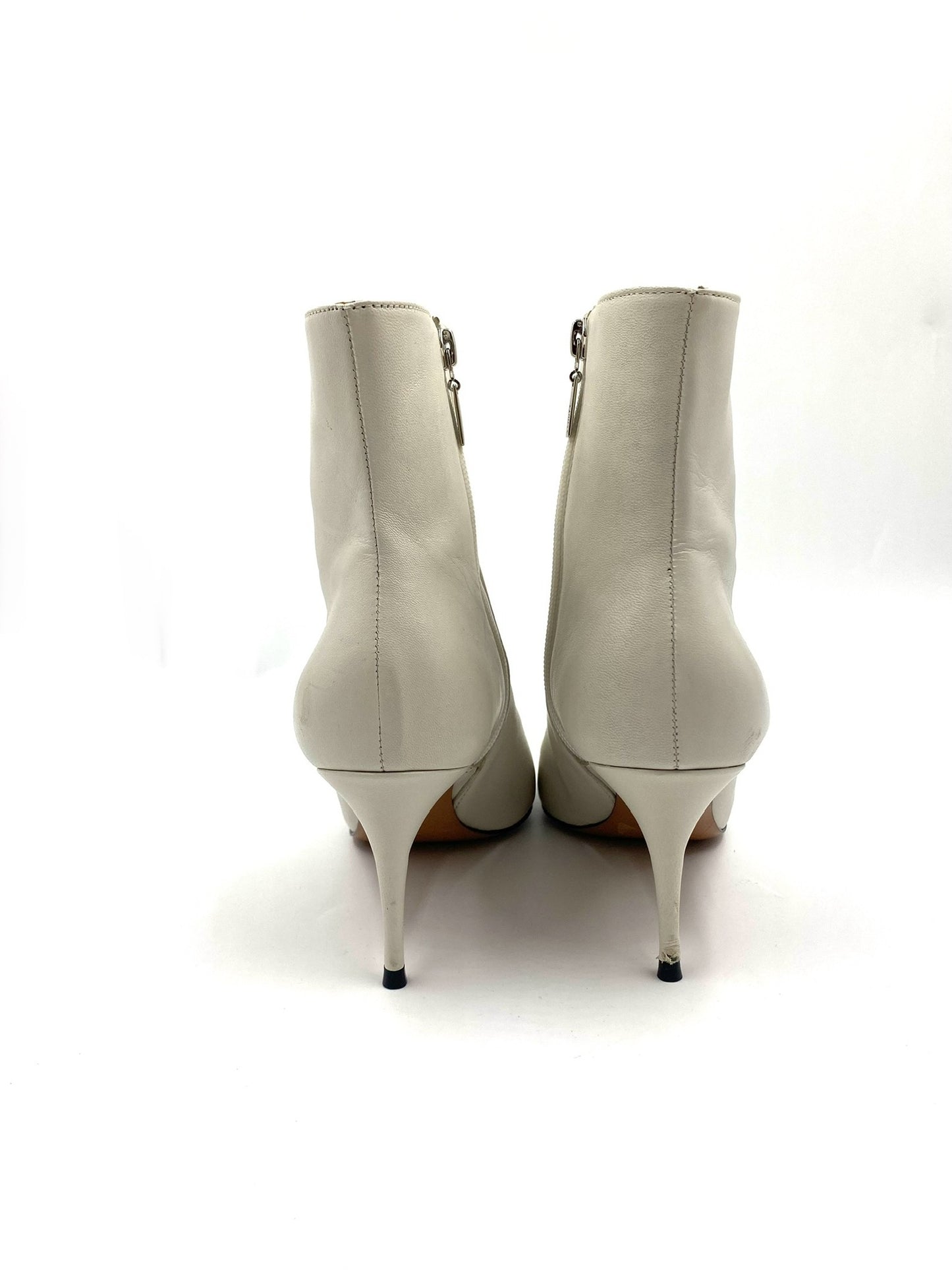 Schutz white pointed ankle boots, size 8B, with side zip closures and stiletto heels.