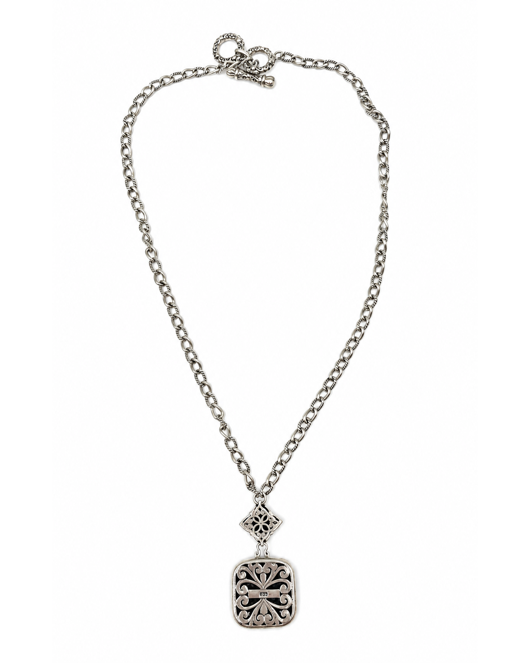 Two-tone hammered square pendant necklace with sterling silver chain, ornate scrollwork, and a floral connector.