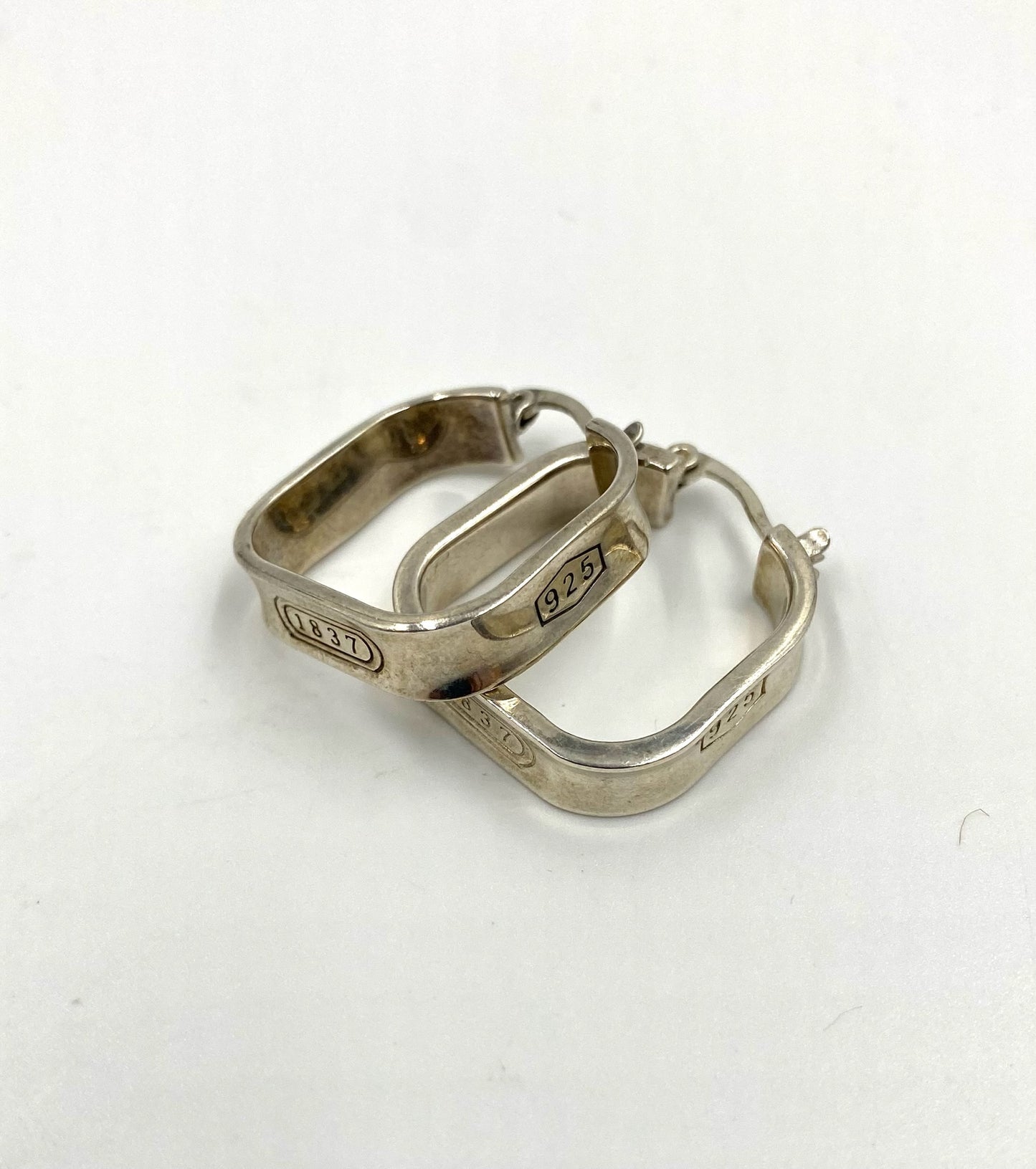 Tiffany & Co 1837 sterling silver square hoop earrings with "925" engraving.