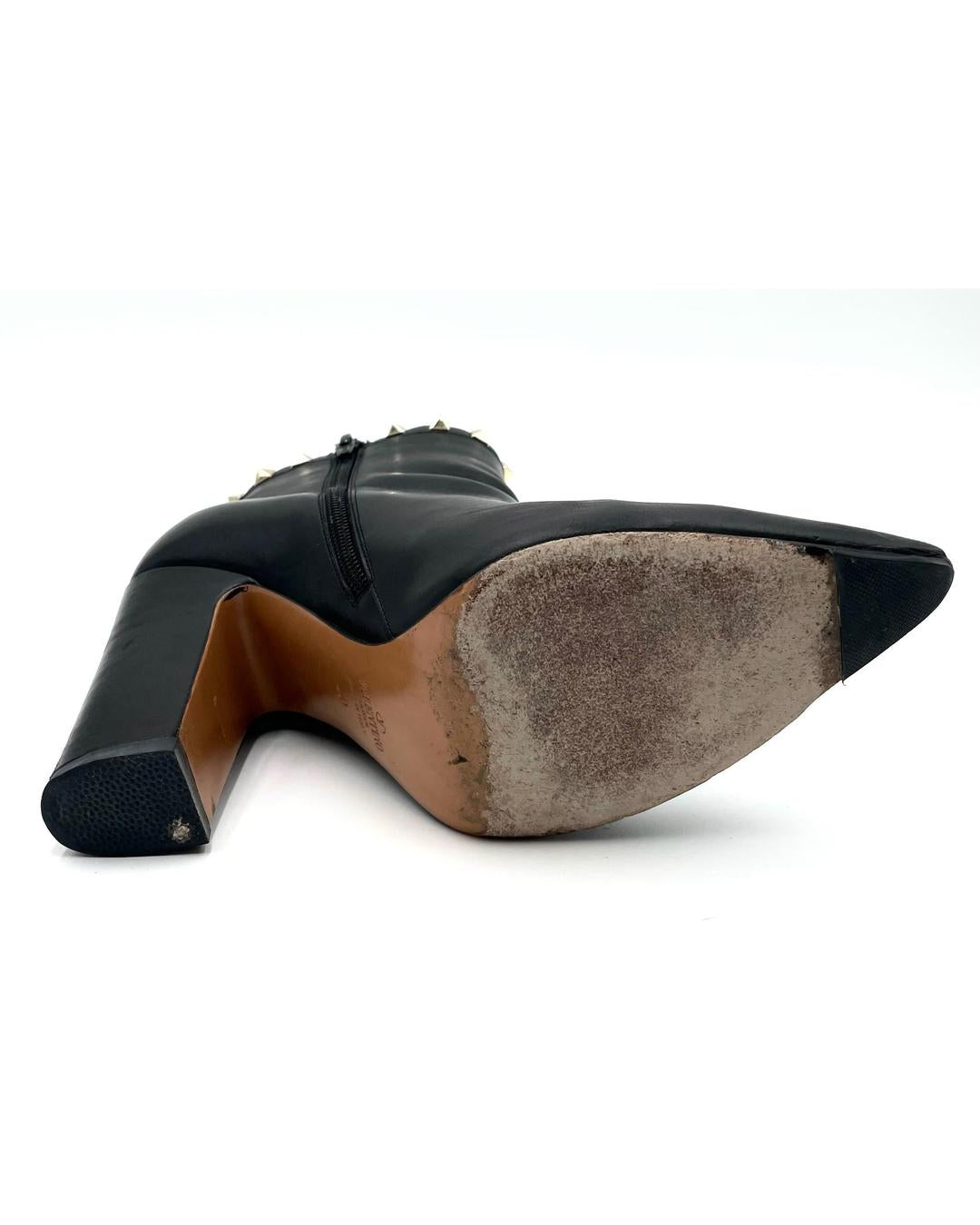 Valentino Garavani black leather pointed-toe ankle bootie with block heel and worn sole, size 40.