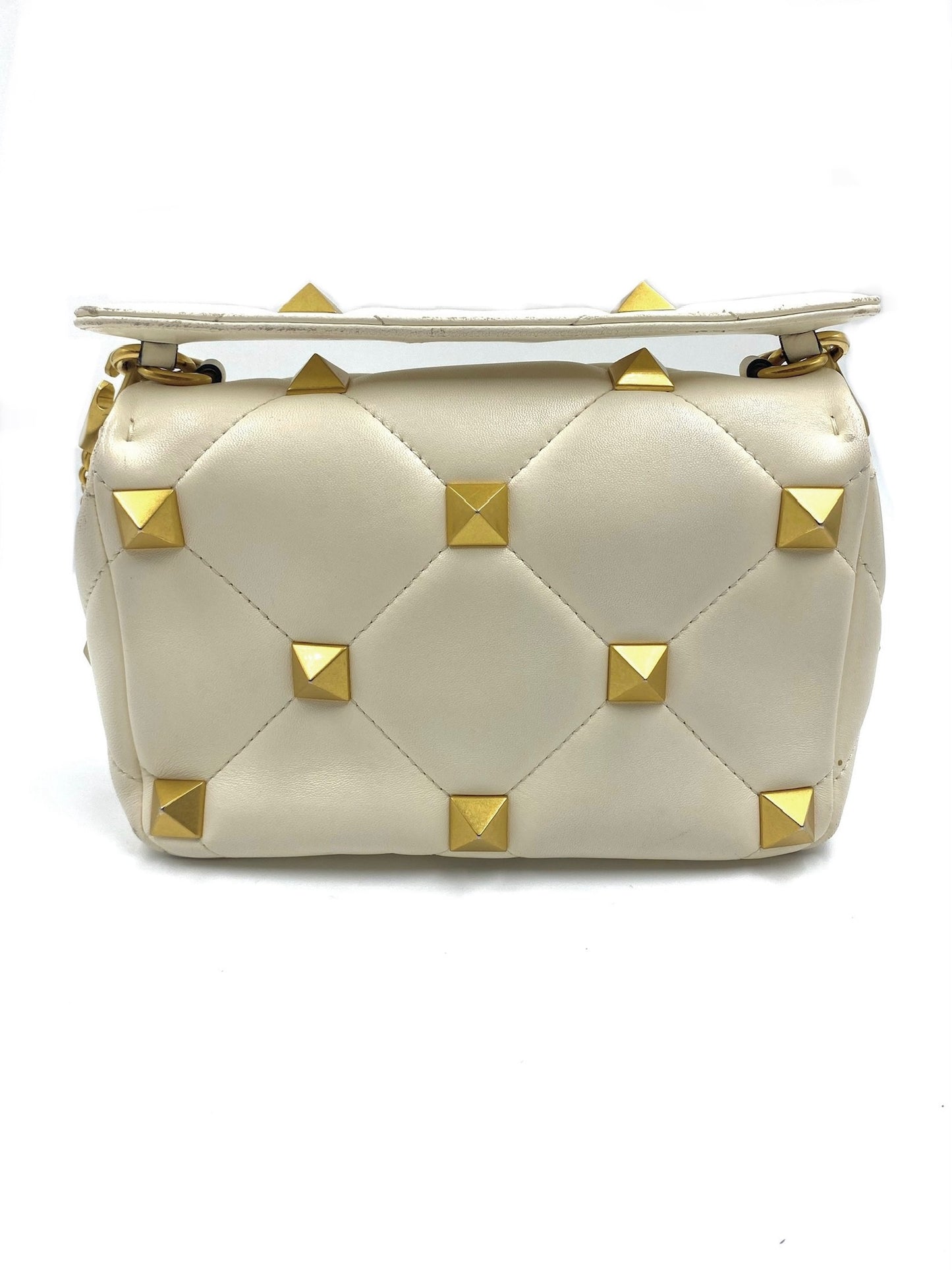 Valentino Garavani white quilted leather Roman Stud bag with gold studs and hardware.
