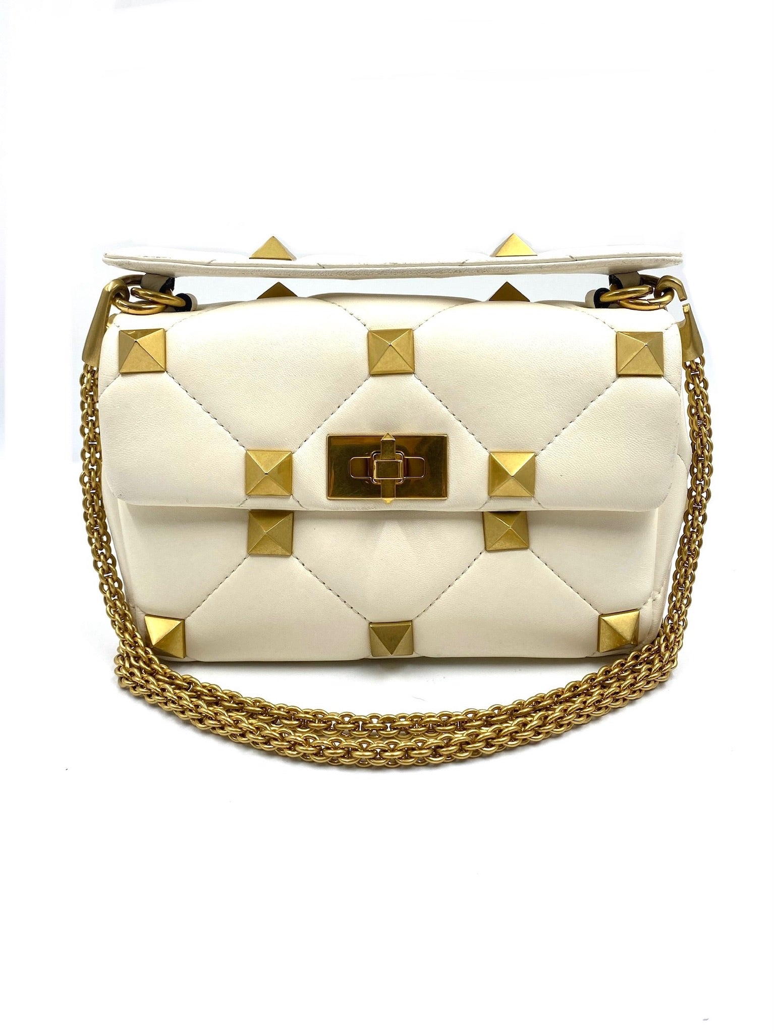 Valentino Garavani white quilted leather Roman Stud bag with gold hardware and chain strap.