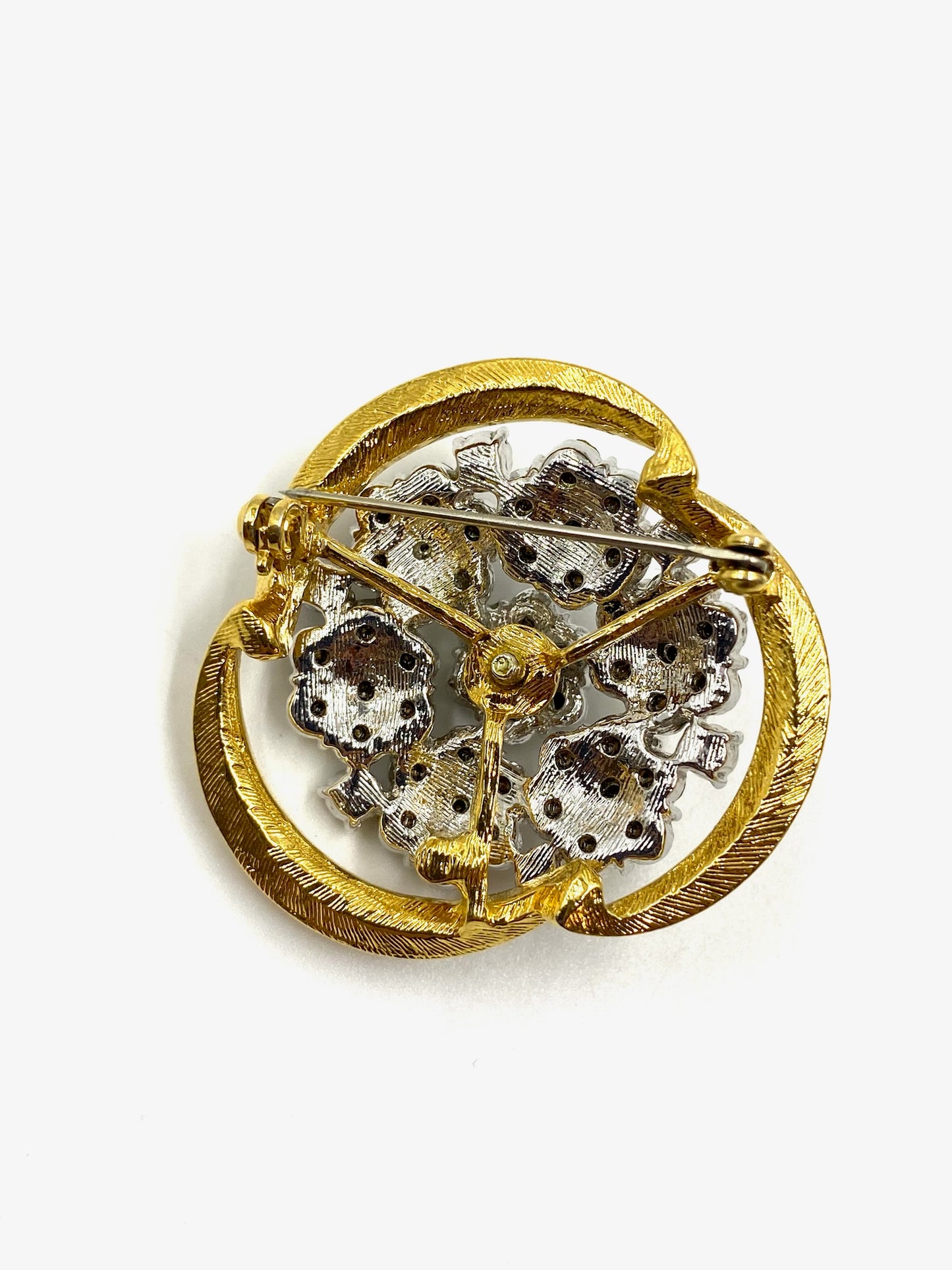 Back of vintage gold and silver floral nosegay brooch with pin clasp.