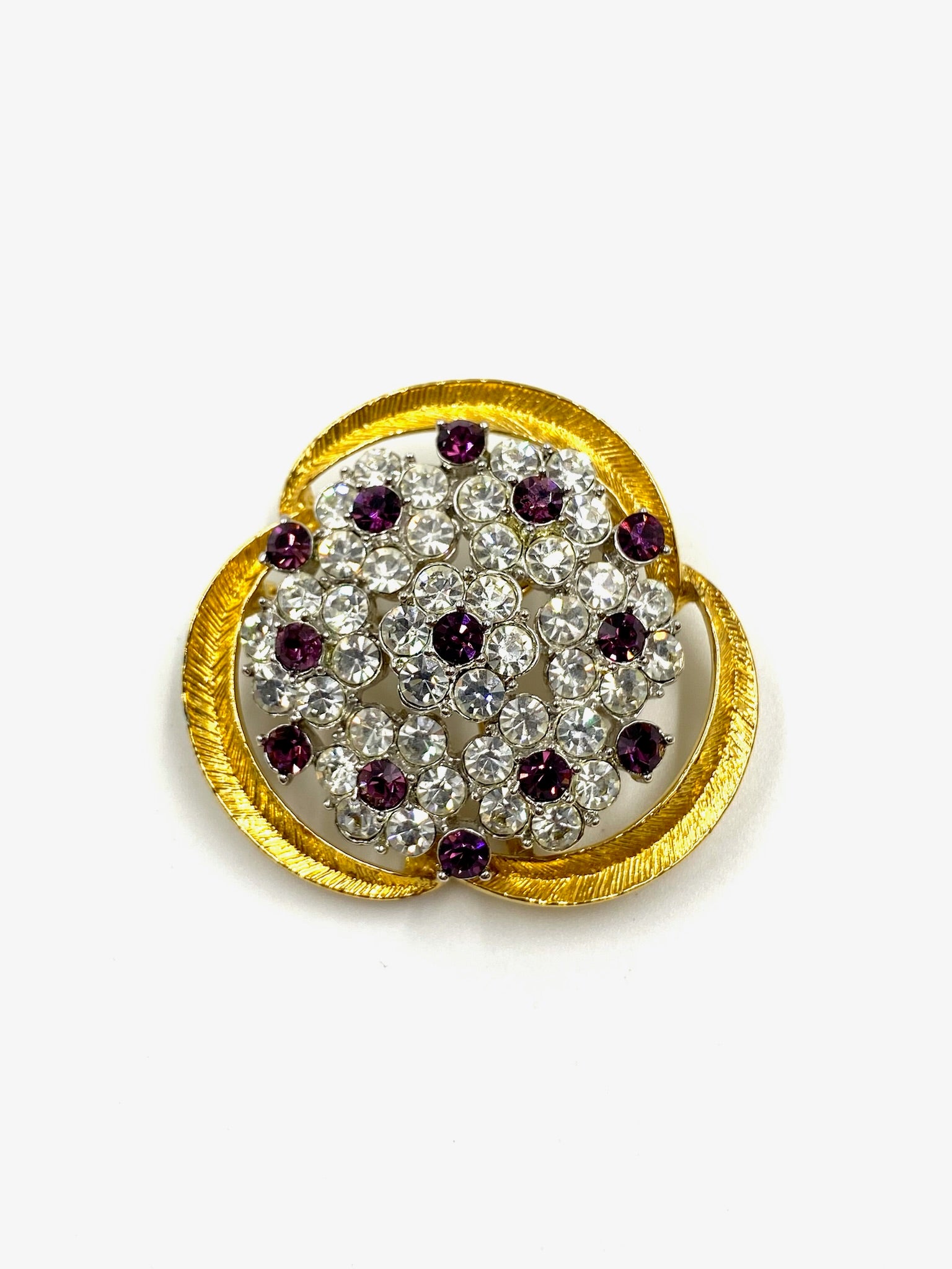 Vintage gold & silver floral nosegay brooch with faceted amethyst and clear crystal stones, 1.5" wide.