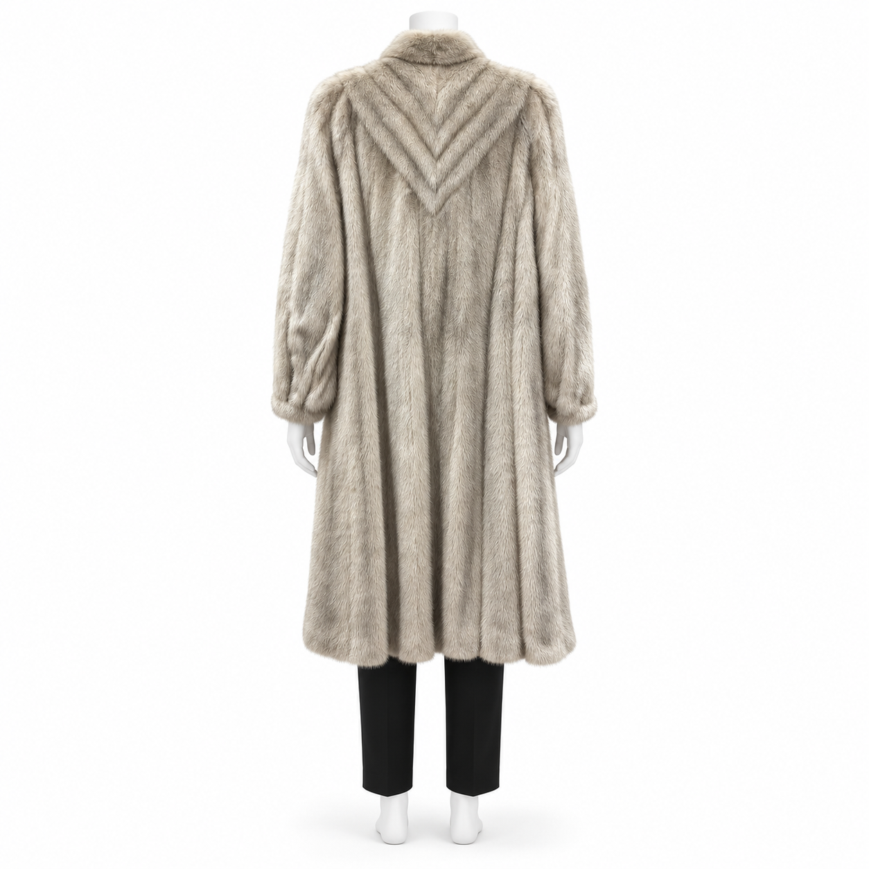 Vintage cream mink fur coat with chevron back detailing and shawl collar on a mannequin.