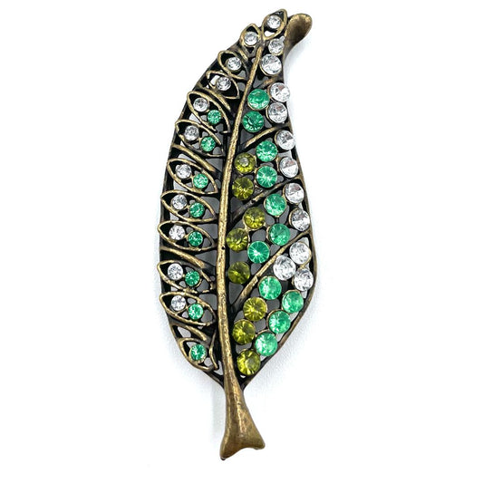Vintage green and clear rhinestone leaf brooch with antique gold-tone finish.