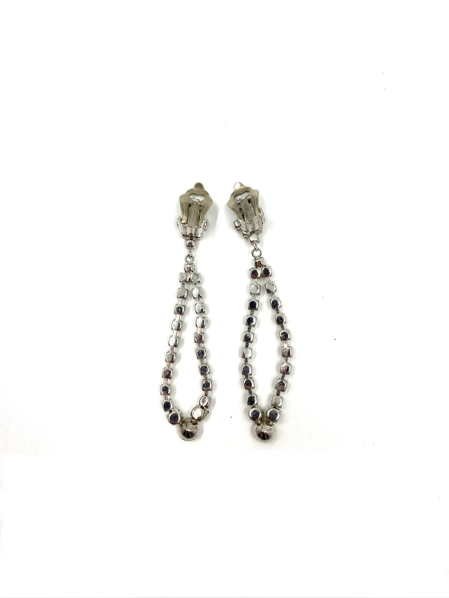 Vintage silver-tone rhinestone drop clip-on earrings, 2.5" long, with sparkling clear stones.