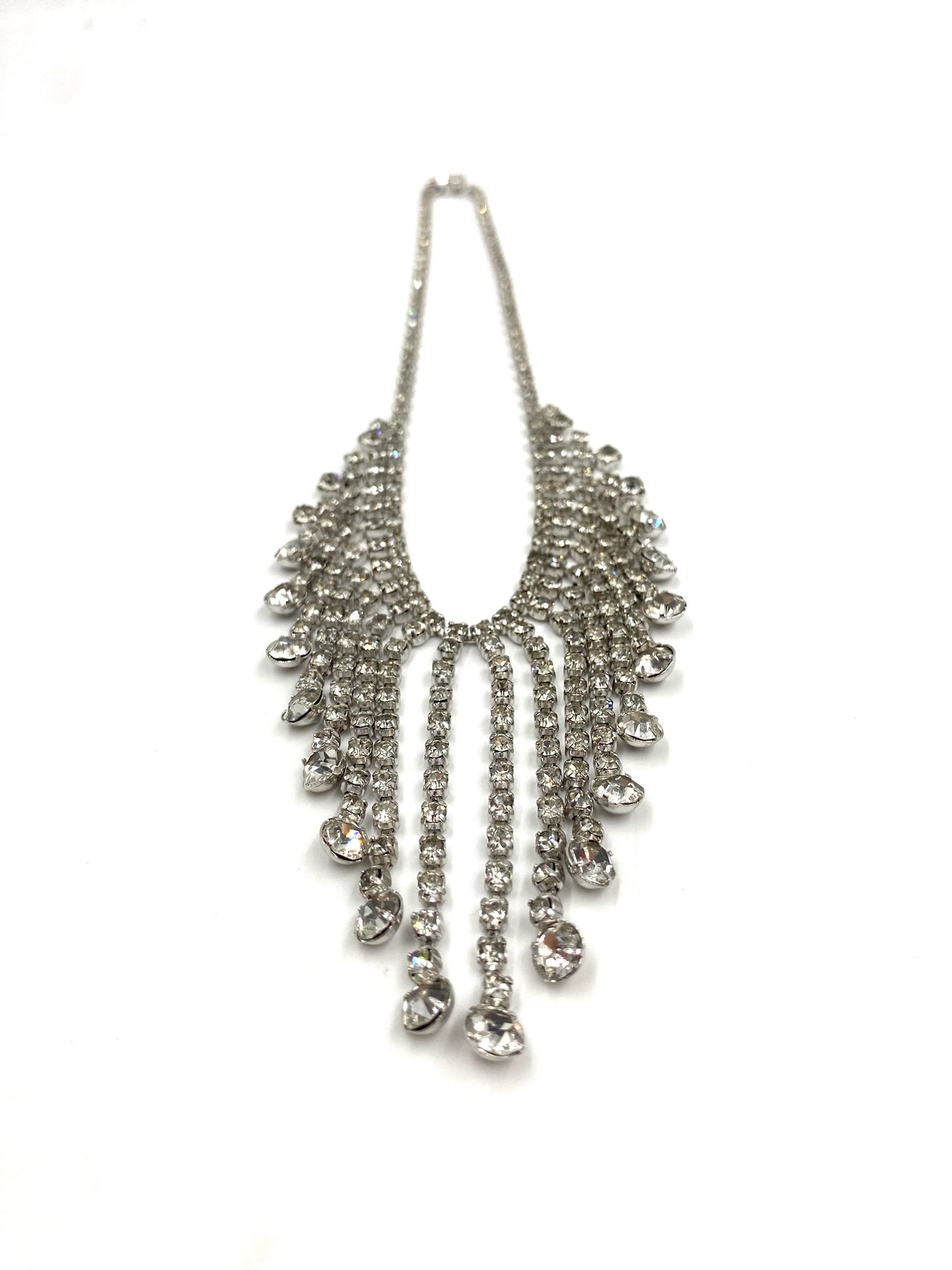 Vintage silver rhinestone necklace with cascading drop design.