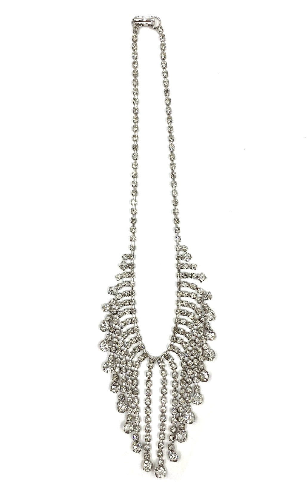Vintage silver-tone rhinestone necklace with a cascading 7-inch drop design.