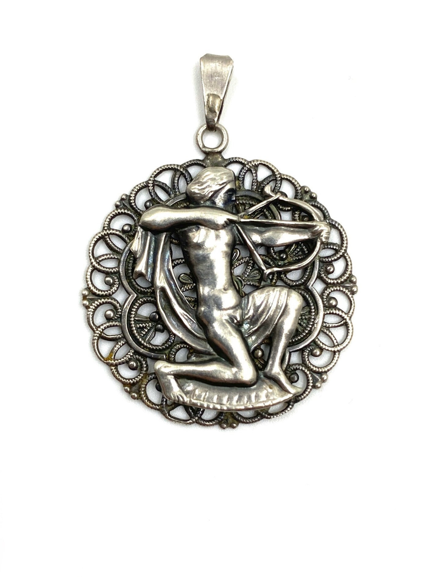 Vintage sterling silver Sagittarius pendant, 1.0” wide, featuring an archer within a filigree circle.